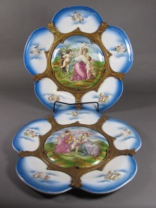 A pair of Continental blue glazed porcelain plates decorated classical scenes with gilt metal mounts 13"
