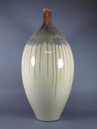 A large treacle glazed bottle shaped vase 24"