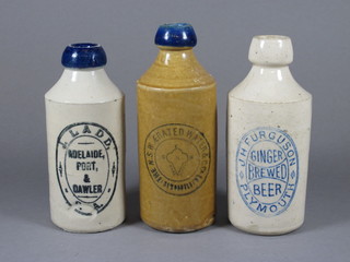 A white glazed stoneware ginger bottle with blue label marked J  H Ferguson Plymouth, 2 other blue lipped ginger beer bottles  marked J Ladd of Adelaide Port and N.S.W. Aerated Water Co.