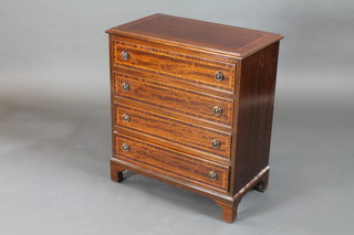 A Georgian style inlaid mahogany chest with crossbanded top  above 4 long drawers, raised on bracket feet 25"w x 14 1/2"d x  29"h