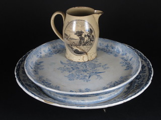 A Wedgwood blue and white tazza, a blue and white dish  together with a 19th Century Creamware jug with transfer  decoration 5", f,