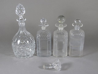 A cut glass mallet shaped decanter and stopper 11" and 3 spirit decanters