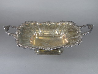 A 19th Century silver plated twin handled dish, raised on an  oval spreading foot 17"