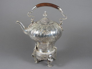 An embossed silver plated tea kettle and stand