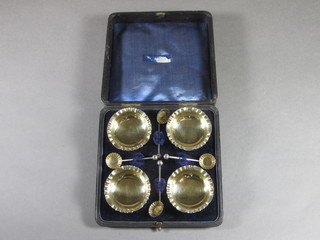 A set of 4 Victorian circular silver salts and spoons, Birmingham 1892, 2 ozs, cased