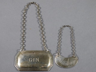 A silver decanter label marked Whisky, London 1909 and 1 other  marked Gin