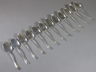 A set of 12 silver Old English rat tail pattern sorbet spoons with armorial decoration, Sheffield 1909, 4 1/2 ozs