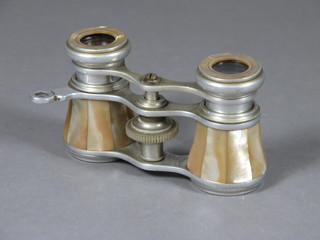 A pair of opera glasses contained in a mother of pearl case