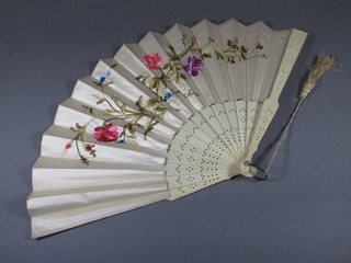 A Victorian carved bone and embroidered silk fan