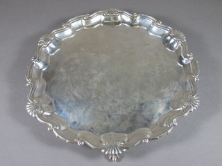A silver salver with bracketed border, raised on ball and claw  feet, Sheffield 1912, 15 ozs