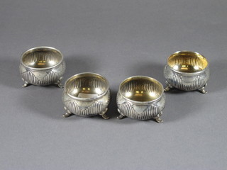 A set of 4 circular silver plated salts with demi-reeded decoration