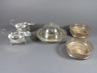 A pair of silver plated sauce boats by Elkington, a pair of silver  plated bottle coasters and a circular silver plated muffin dish and  cover