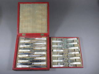 A handsome set of 12 Georgian silver and mother of pearl  mounted fruit knives and forks, cased  ILLUSTRATED