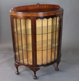 A Chippendale style mahogany bow front display cabinet, the shelved interior enclosed by astragal glazed panelled doors, raised  on cabriole supports 40"w x 17"d x 52"h
