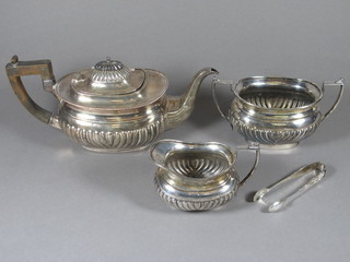 An oval silver plated 3 piece teaset of demi-reeded form with teapot, twin handled sugar bowl and milk jug