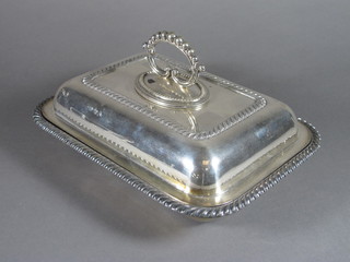 A rectangular silver plated entree dish and cover with gadrooned border