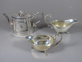 An oval engraved Britannia metal teapot and 2 silver plated sauce  boats