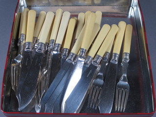 A set of 12 silver plated fish knives and forks