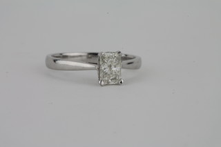 An 18ct white gold dress ring set a rectangular Princess cut  diamond, approx 1ct