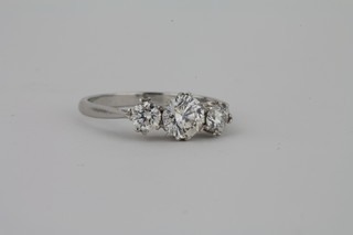 A lady's 18ct white gold engagement/dress ring set 3 diamonds,  approx 1.10ct