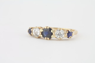A lady's 18ct yellow gold dress ring set sapphires and diamonds
