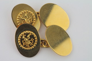 A pair of 9ct oval gold cufflinks decorated the crest of The  Midland Bank
