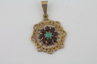 A gilt metal pendant set coloured stones