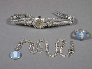 A lady's silver marcasite cocktail wristwatch and a silver and  Wedgwood ring and a fine silver chain hung a Wedgwood  pendant
