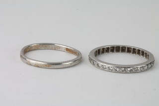 A platinum wedding band together with an eternity ring
