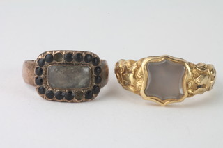A Georgian gilt metal ring together with a gilt metal mourning ring