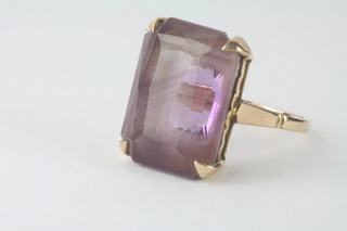 A 9ct gold dress ring set a rectangular cut amethyst