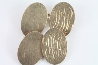 A pair of 9ct oval gold cufflinks