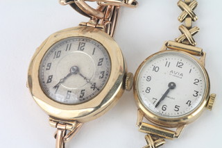 A lady's Avia gold wristwatch contained in a 9ct gold case with integral bracelet and 1 other gold cased wristwatch