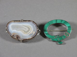 A silver and malachite shaped brooch in the form of a ribbon together with a silver hardstone brooch