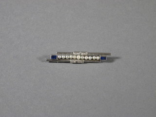 A white gold bar brooch set demi-pearls, diamonds and 2 rectangular cut sapphires
