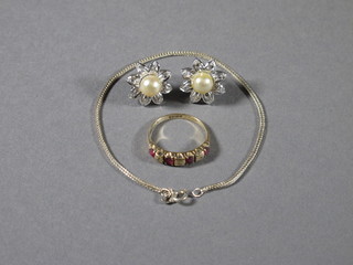 A lady's 18ct gold dress ring set 4 red stones supported by  diamonds, together with a pair of ear studs and a fine silver chain