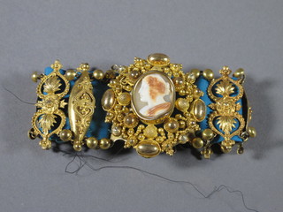 A Victorian pierced gilt metal bracelet set a cameo portrait of a lady