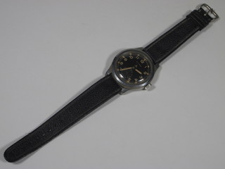 A 1960's Cyma military issue gents wristwatch, the black Arabic  dial marked with tritium and set second subsidiary dial, military  markings to verso  ILLUSTRATED