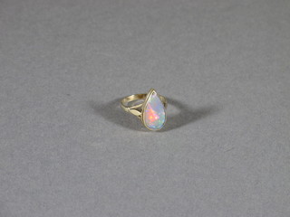 A 9ct yellow gold dress ring set a tear drop shaped opal