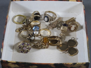 A collection of minor gold jewellery including dress rings,  charms etc