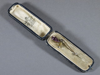 A late 19th Century amethyst and yellow metal tie pin and 3 other tie pins