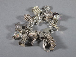 A silver charm bracelet hung numerous charms