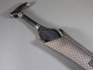 A lady's umbrella with silver and "tortoiseshell" mounted handle