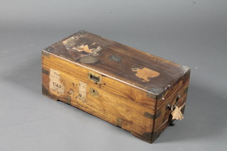 An unusual late 19th Century camphor wood and brass bound  coffer of small proportions, having a hinged top and end handles,  with various distressed travel labels of a voyage to South Africa  etc 10"h x 25"w x 12"d
