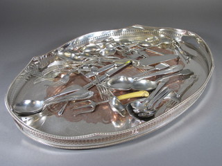 A collection of silver plated flatware
