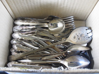 A collection of silver plated flatware