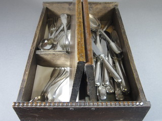 A quantity of WMF silver plated fiddle and thread pattern  flatware and various Continental silver handled knives in an oak  cutlery box