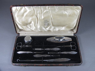 An Art Deco 9 piece silver backed manicure set London 1935,  cased