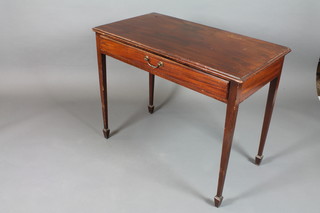 A late George III mahogany side table fitted a frieze drawer, raised on square tapered legs, spade feet 30"h x 38"w x 21"d