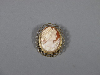 A shell carved cameo brooch in a gold mount